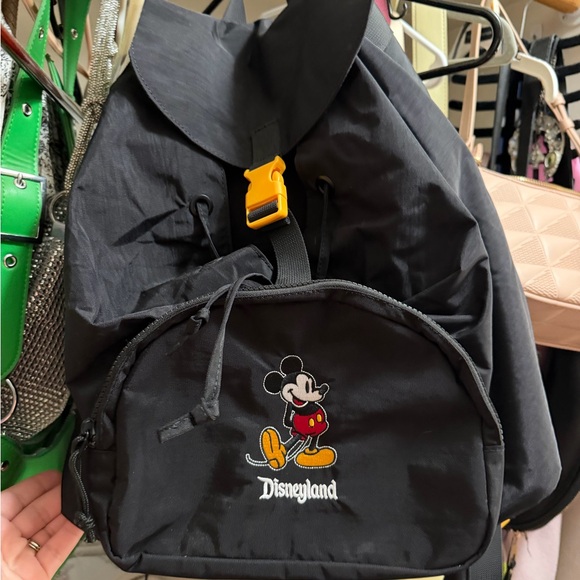 Disney Handbags - Disney Black Sling Backpack with Triangular Shape